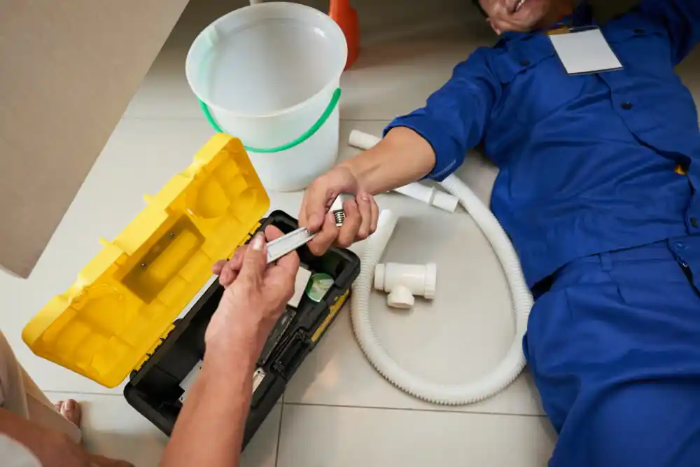 plumber fixing a leak