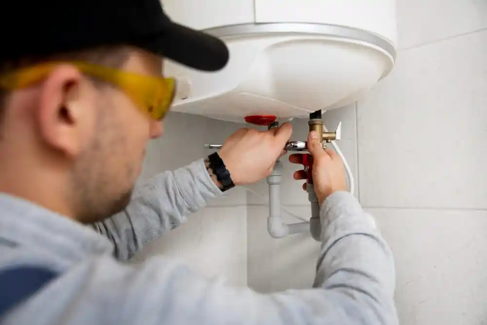 plumber repairing water heater
